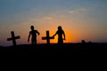 Silhouette some zombies on the cemetery walking around at sunset Royalty Free Stock Photo