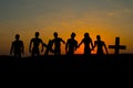 Silhouette some zombies on the cemetery walking around at sunset Royalty Free Stock Photo