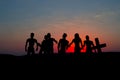 Silhouette some zombies on the cemetery walking around at sunset Royalty Free Stock Photo