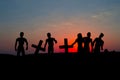 Silhouette some zombies on the cemetery walking around at sunset Royalty Free Stock Photo