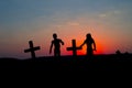 Silhouette some zombies on the cemetery walking around at sunset Royalty Free Stock Photo