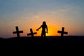 Silhouette some zombies on the cemetery walking around at sunset Royalty Free Stock Photo