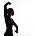 Silhouette of spanish girl flamenco dancer on a light background. free space for your text Royalty Free Stock Photo