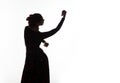 Silhouette of spanish girl flamenco dancer on a light background. free space for your text Royalty Free Stock Photo