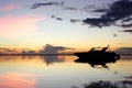 Silhouette of speed boat with beautiful sunrise background Royalty Free Stock Photo