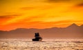 Silhouette of Speed boat in the ocean at sunset. Royalty Free Stock Photo