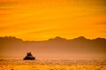 Silhouette of Speed boat in the ocean at sunset. Royalty Free Stock Photo