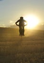 Silhouette sport man cycling downhill riding cross country mount Royalty Free Stock Photo