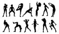 Silhouette of sportive young women doing exercises Royalty Free Stock Photo