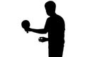 Silhouette of a sportsman getting ready to hit a ping pong ball Royalty Free Stock Photo