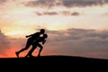 Silhouette of sportsmen ready to start. Royalty Free Stock Photo