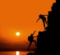 Silhouette sporty woman on the cliff with help Royalty Free Stock Photo