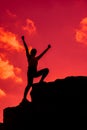 Silhouette Sporty woman climbing on the cliff. Business Success and goal concept. Strong and healthy
