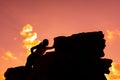 Silhouette Sporty woman climbing on the cliff. Royalty Free Stock Photo