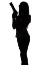 Silhouette of spy woman with gun Royalty Free Stock Photo