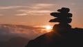 Silhouette of stacked stones with sunset on the background Royalty Free Stock Photo