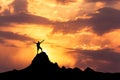 Silhouette Of A Standing Happy Man On The Mountain Peak