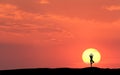 Silhouette of a standing sporty woman practicing yoga Royalty Free Stock Photo