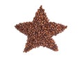 Silhouette of a star made from coffee beans on a white isolated background. Design element. Top view, flat lay Royalty Free Stock Photo