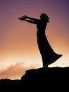 Silhouette of a statue of a woman, her hands outstretched in prayer. Waiting on a shore, Rosses point, coutny Sligo, Ireland Royalty Free Stock Photo