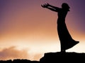 Silhouette of a statue of a woman, her hands outstretched in prayer. Waiting on a shore, Rosses point, coutny Sligo, Ireland Royalty Free Stock Photo