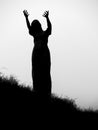 Silhouette of a statue of a woman, her hands outstretched in prayer. Waiting on a shore, Rosses point, coutny Sligo, Ireland Royalty Free Stock Photo
