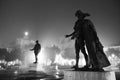 Silhouette of statues at foggy night on Umberto Giordano square in Foggia