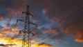 Silhouette of steel lattice tower on dramatic sky background. Transmission tower, used to support an overhead power line Royalty Free Stock Photo