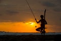 Silhouette of stilt fisherman at sunset in Koggala, Sri Lanka Royalty Free Stock Photo