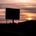 Silhouette of street sign on sunset. Royalty Free Stock Photo