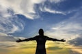Silhouette of strong confidence woman open arms under the sunris Royalty Free Stock Photo