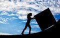 Silhouette of a strong woman pushing a cube to the top.