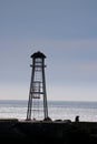 Silhouette of structure on breakwater Oamaru Harbor Royalty Free Stock Photo