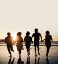 Silhouette, summer and friends holding hands at sunset beach for fun and travel. Banner space, men and women group Royalty Free Stock Photo