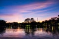 Silhouette sunset in the evening the tree is shadows dark. There are ponds that reflect light Blue sky and clouds Royalty Free Stock Photo