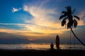 Silhouette of surf man sit with a surfboard on the beach. Royalty Free Stock Photo