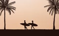 Silhouette couple surfer carrying surfboard on beach under sunset sky background in flat icon design Royalty Free Stock Photo