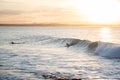 Silhouette of Surfer Catching a Wave at Sunset Time in Noosa,Queensland,Australia.Copy Space Royalty Free Stock Photo