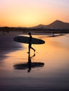 Silhouette of a Surfer on Famara beach at sunset