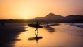 Silhouette of a Surfer on Famara beach at sunset