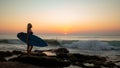 Silhouette of surfer girl with surfboard at the beach. Sunset time. Tegal Wangi beach, Bali, Indonesia Royalty Free Stock Photo