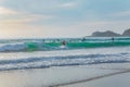 Silhouette Of surfer people on sunset beach catch oceans wave.Surfing sport and travel concept