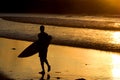 Silhouette of surfer at a yellow sunset Royalty Free Stock Photo