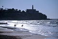 Silhouette of surfers against Jaffa old city port skyline Israel Royalty Free Stock Photo