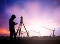 Silhouette survey engineer working in a building site over Blur