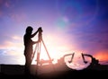 Silhouette survey engineer working in a building site over Blur