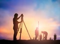 Silhouette survey engineer working in a building site over Blur