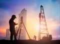 silhouette survey engineer working in a building site over Blurred construction worker on construction site