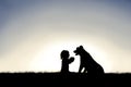 Silhouette of Sweet Little Child Sitting Outside with her Loyal Family Pet Dog