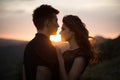 Silhouette sweethearts at sunset. Silhouettes of a young couple lovers at sunset in rays of setting sun Royalty Free Stock Photo